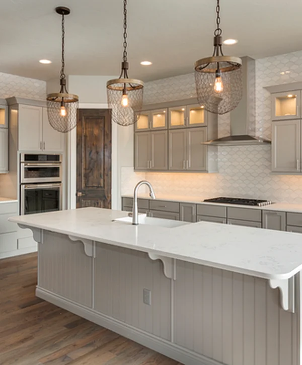 kitchen-remodeling-markdown-modern-kitchen-features-sleek-gray-cabinetry-white-marble-countertops-stainless-steel-appliances-elegant-pendant-lighting-and-professional-grade-hardwood-flooring