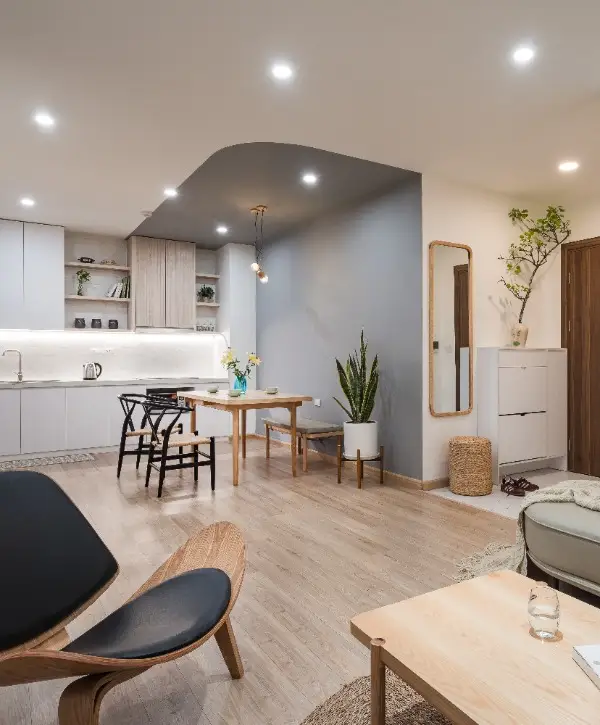 Modern basement featuring a kitchen, living room, and dining area with contemporary furnishings and open layout