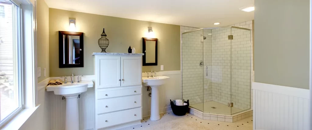 electrical rewiring marlboro nj bathroom remodeling modern bathroom with dual pedestal sinks glass shower enclosure white cabinetry and beige walls