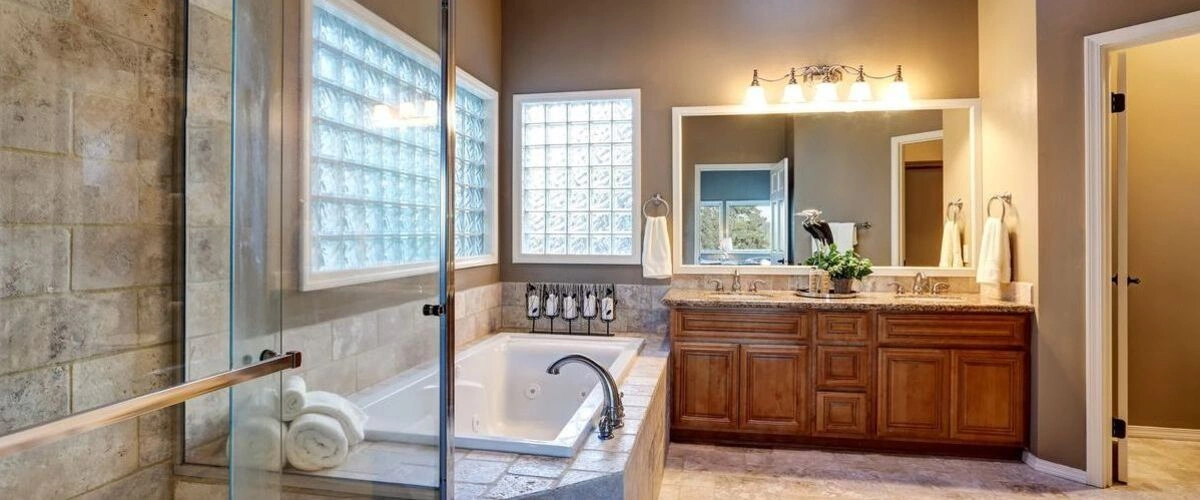 traditional bathroom jetted tub glass blocks