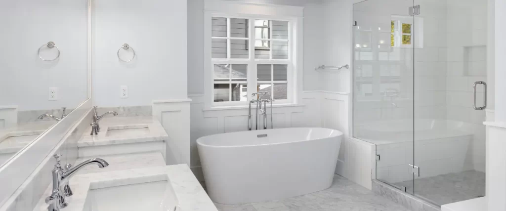 a modern, luxurious bathroom interior featuring a clean, all white design