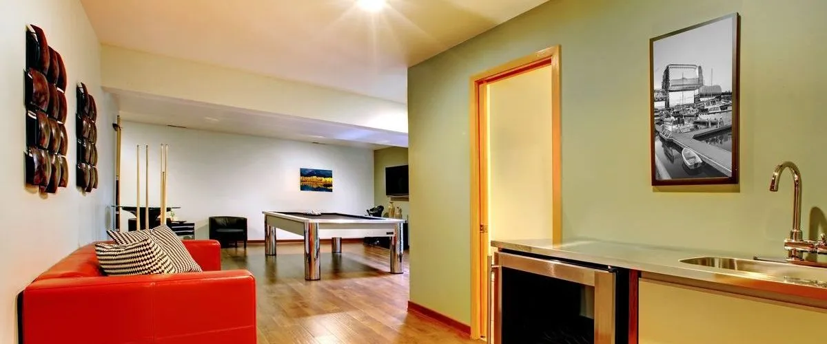 contemporary basement design with wet bar lounge area and billiards table